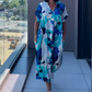 👗49% RABATT! 🌸 Elegant V-halsad Klänning med Tryck för Kvinnor – Flytande Tyg, Smickrande Passform & Perfekt för Våren ☀️