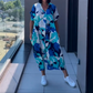 👗49% RABATT! 🌸 Elegant V-halsad Klänning med Tryck för Kvinnor – Flytande Tyg, Smickrande Passform & Perfekt för Våren ☀️